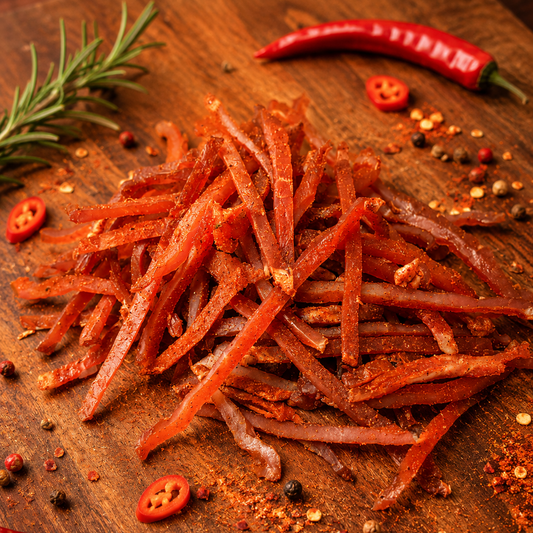 Spicy Pork Jerky Strips made from pork loin, seasoned with spices and dried for a smoky, savory flavor.