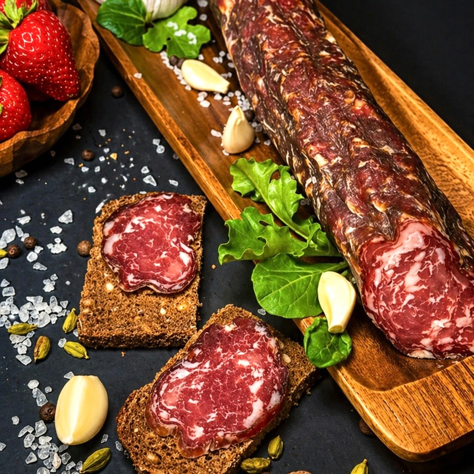 Rustic dry cured pork sausage close up