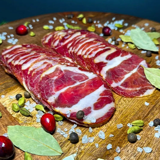 Capocollo style cured pork thinly sliced close-up – Ukrainian Smokehouse