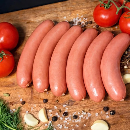 European-Style Pork Sausages arranged on rustic wooden board – Ukrainian Smokehouse
