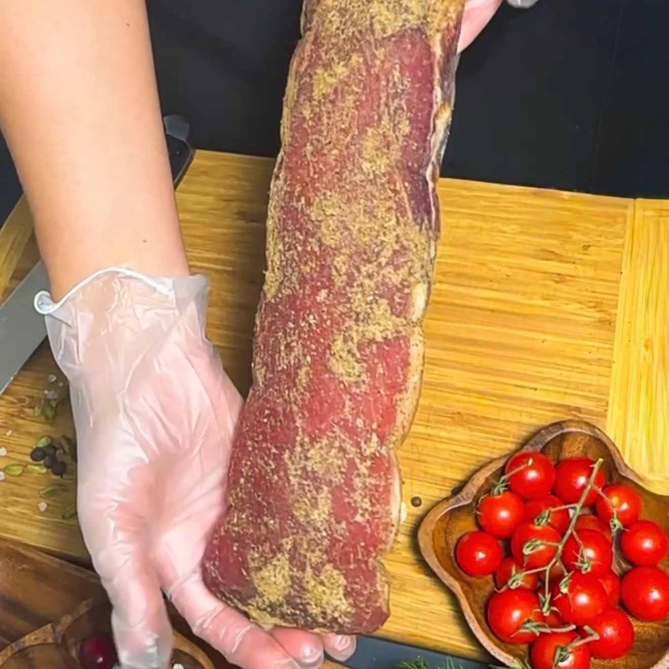Whole Polandvica dry-cured pork loin held by hand – Ukrainian Smokehouse
