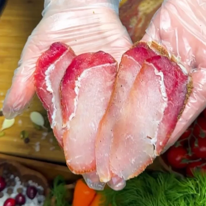 Polandvica dry-cured pork loin thinly sliced in hand – Ukrainian Smokehouse